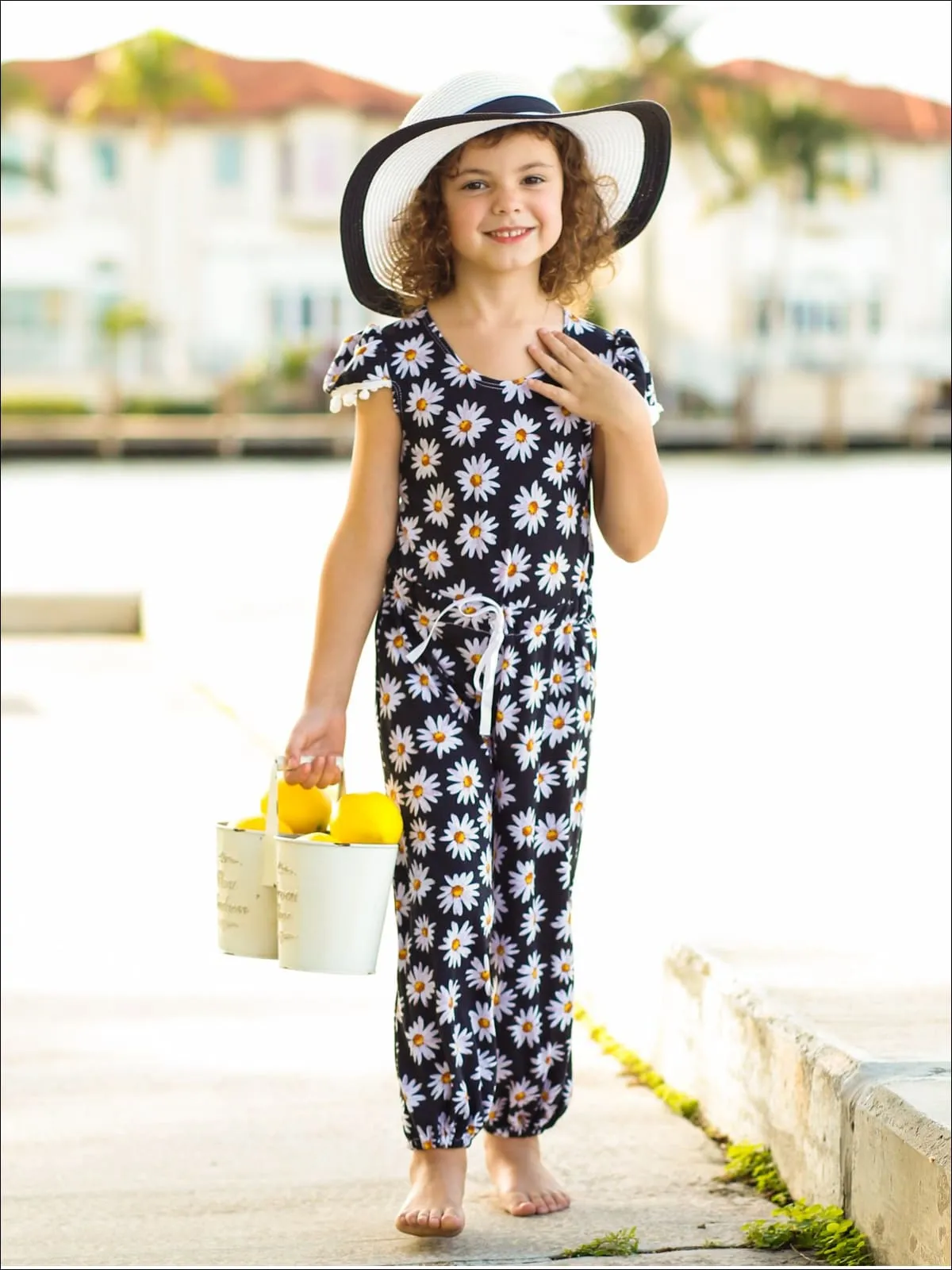 Girls Black Daisy Print Pom Pom Cap Sleeve Ribbon Bow Jumpsuit